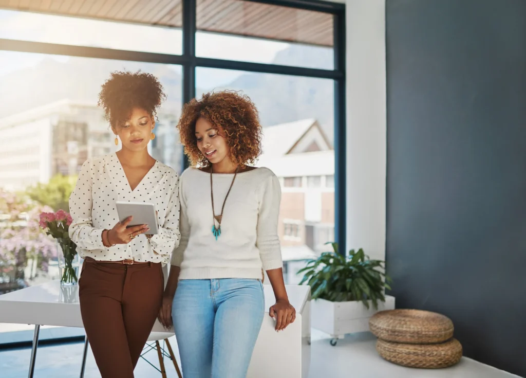 A business owner analyzing their online presence on a laptop with charts and graphs displayed